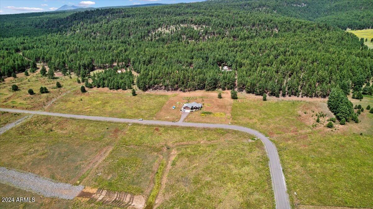 9290 Ranch At The Peaks Way, Unit 12 Flagstaff, AZ 86001 - Photo 7 of 26 a view of a swimming pool with a yard