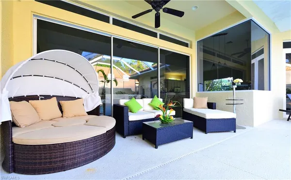 a living room with furniture a window and ceiling fan