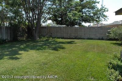 8207 Goodnight Trail Amarillo, TX 79110 - Photo 14 of 16 a view of a yard with a fence and trees