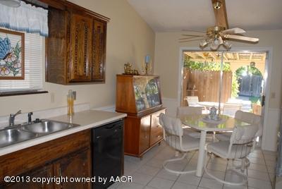 8207 Goodnight Trail Amarillo, TX 79110 - Photo 6 of 16 a dining table chair next to a window