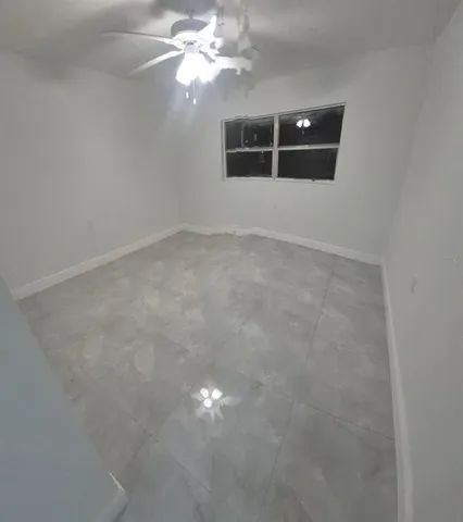 a view of a hallway to rooms