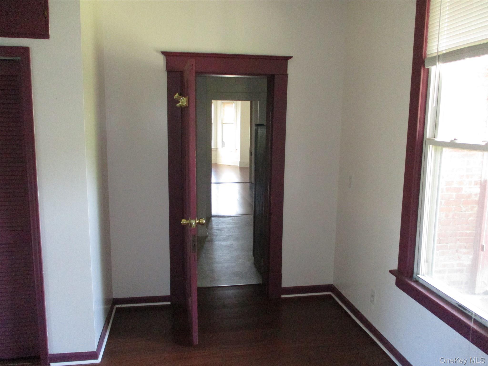 33 Bayview Terrace, Unit 1 Newburgh, NY 12550 - Photo 19 of 20 Hall with plenty of natural light and dark wood-type flooring
