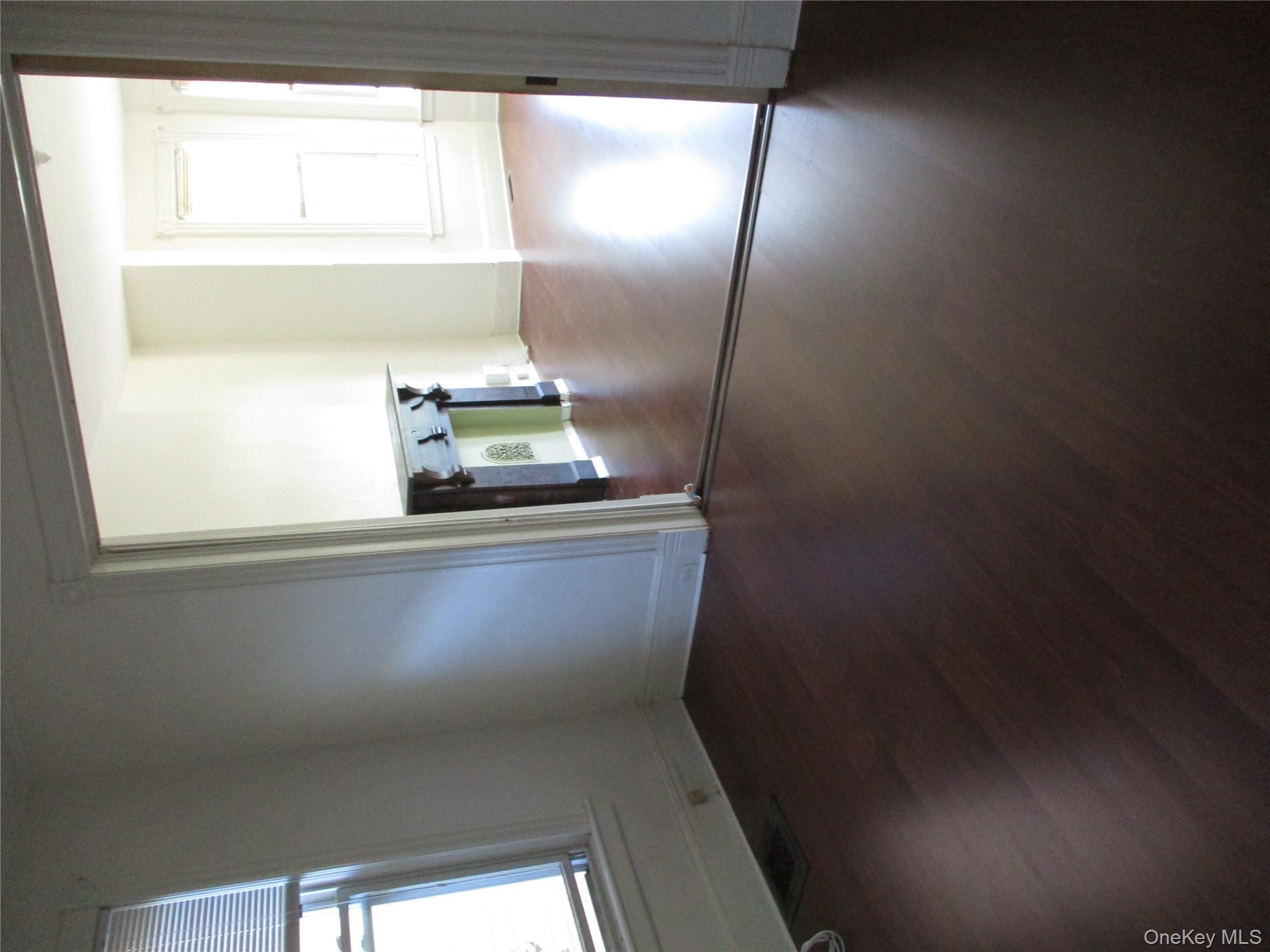 33 Bayview Terrace, Unit 1 Newburgh, NY 12550 - Photo 6 of 20 Spare room featuring healthy amount of natural light and dark wood-style floors