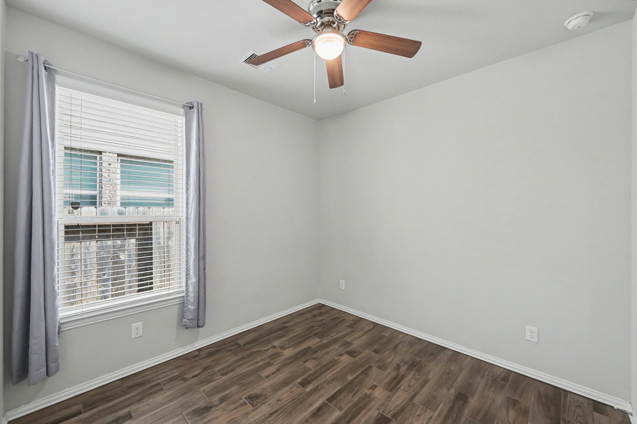 29836 Woodsons Edge Way Spring, TX 77386 - Photo 19 of 38 Secondary bedroom with wood-look flooring.