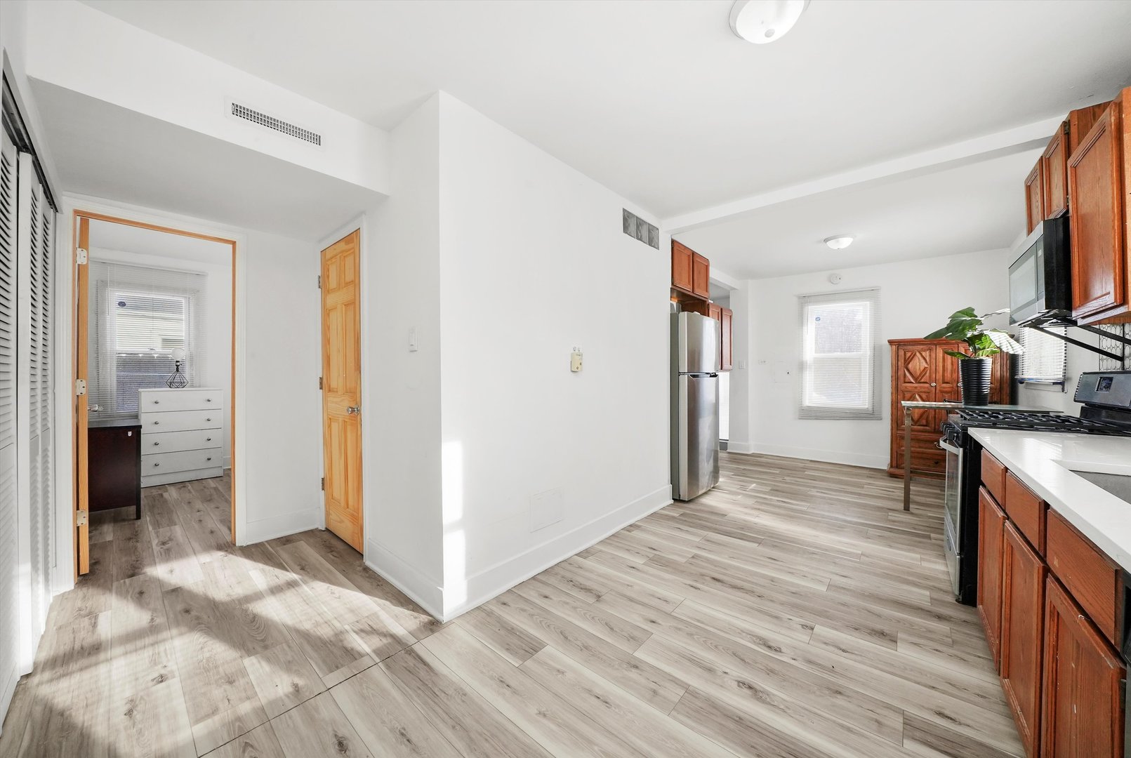 14525 Justine Street Harvey, IL 60426 - Photo 15 of 32 a view of a kitchen from the hallway