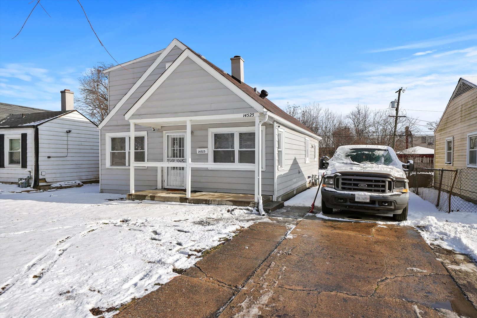 14525 Justine Street Harvey, IL 60426 - Photo 7 of 32 a car parked in front of a house