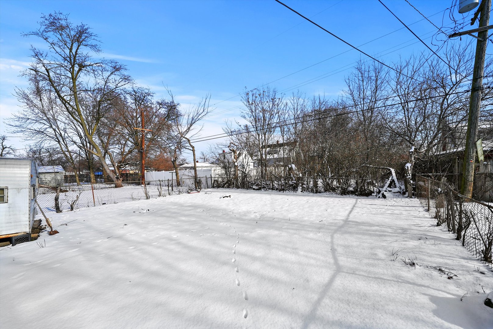 14525 Justine Street Harvey, IL 60426 - Photo 8 of 32 a view of a snow on the side of the road