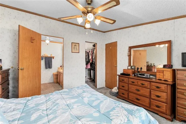 a bed room with a bed and a dresser