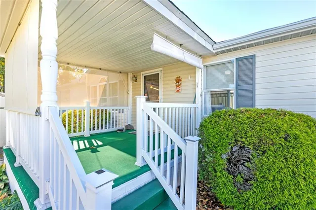 a view of a balcony with wooden floor