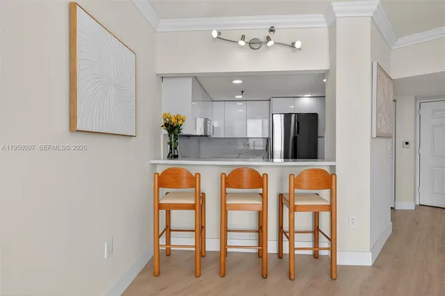 a view of kitchen with furniture and chandelier