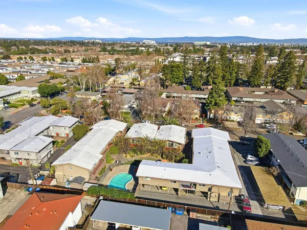 an aerial view of residential house with outdoor space and parking