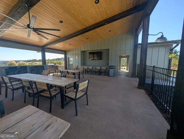 a dining room with furniture and window