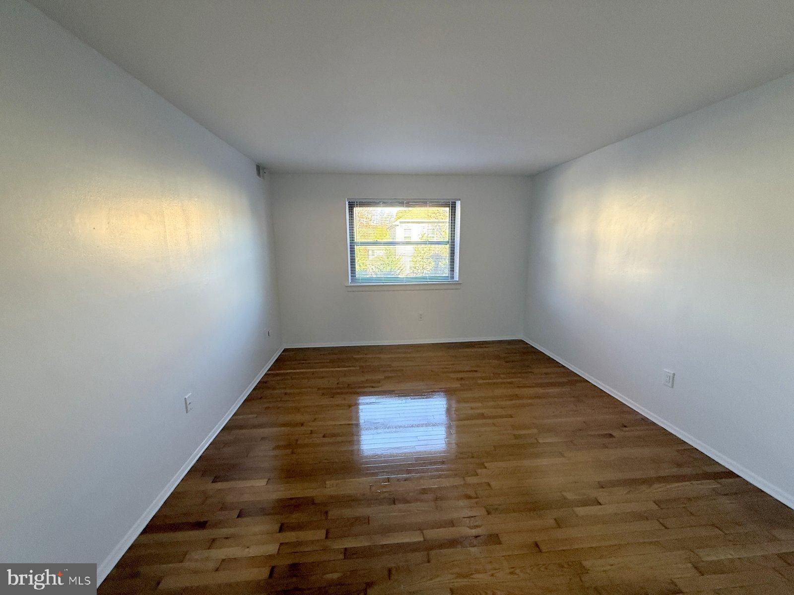 606 Cooper Landing Road, Unit A3E Cherry Hill, NJ 08002 - Photo 11 of 17 wooden floor in an empty room