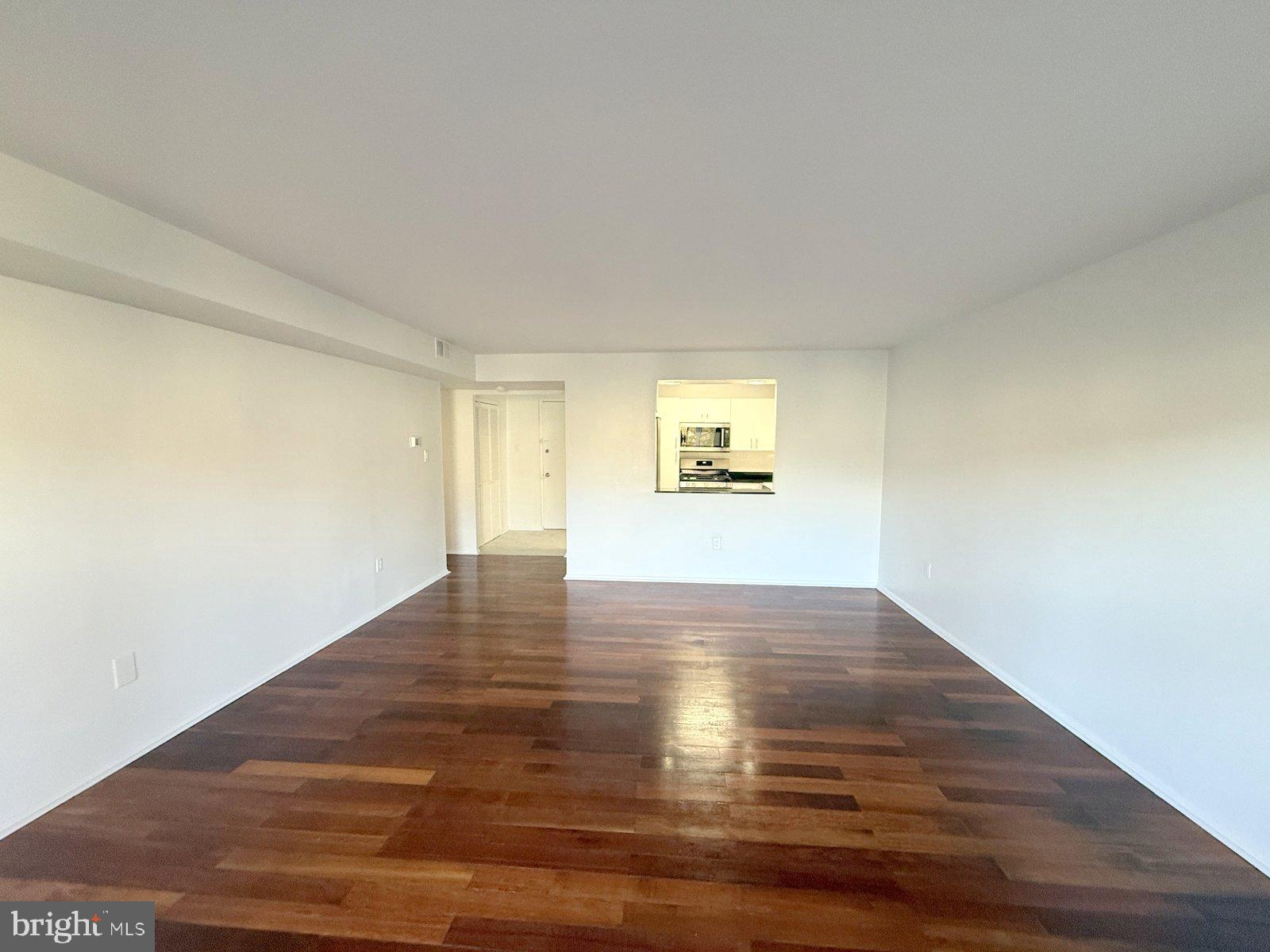 606 Cooper Landing Road, Unit A3E Cherry Hill, NJ 08002 - Photo 9 of 17 a view of empty room with wooden floor and fan