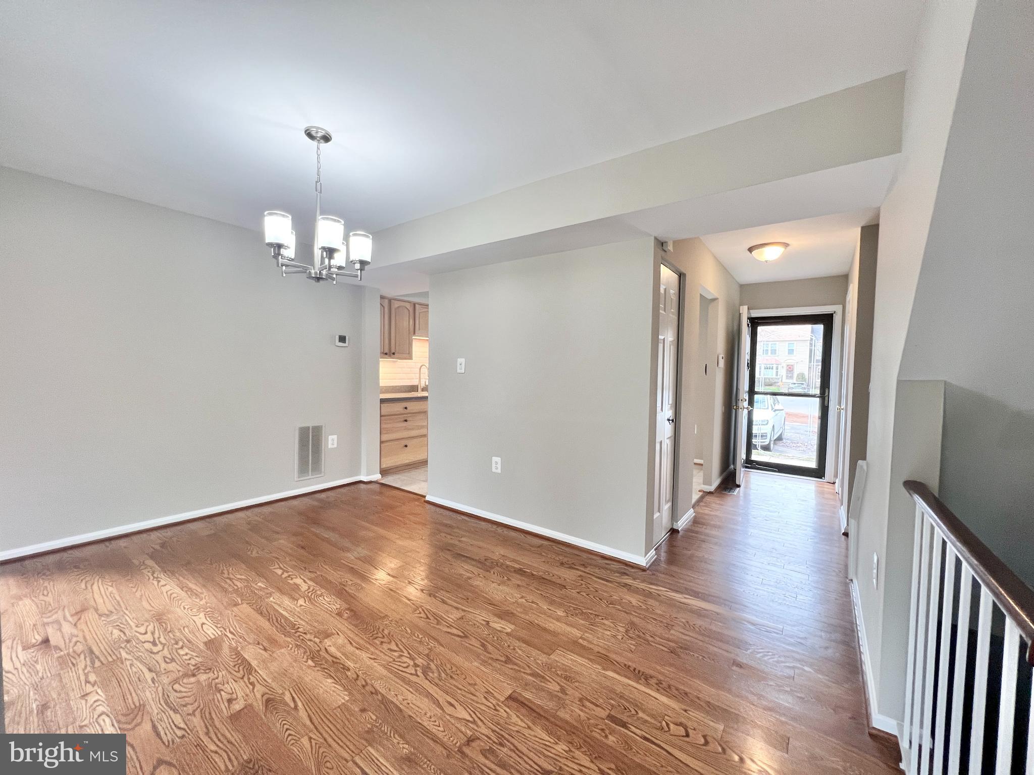 10287 Latney Road Fairfax, VA 22032 - Photo 6 of 26 an empty room with wooden floor and mirror