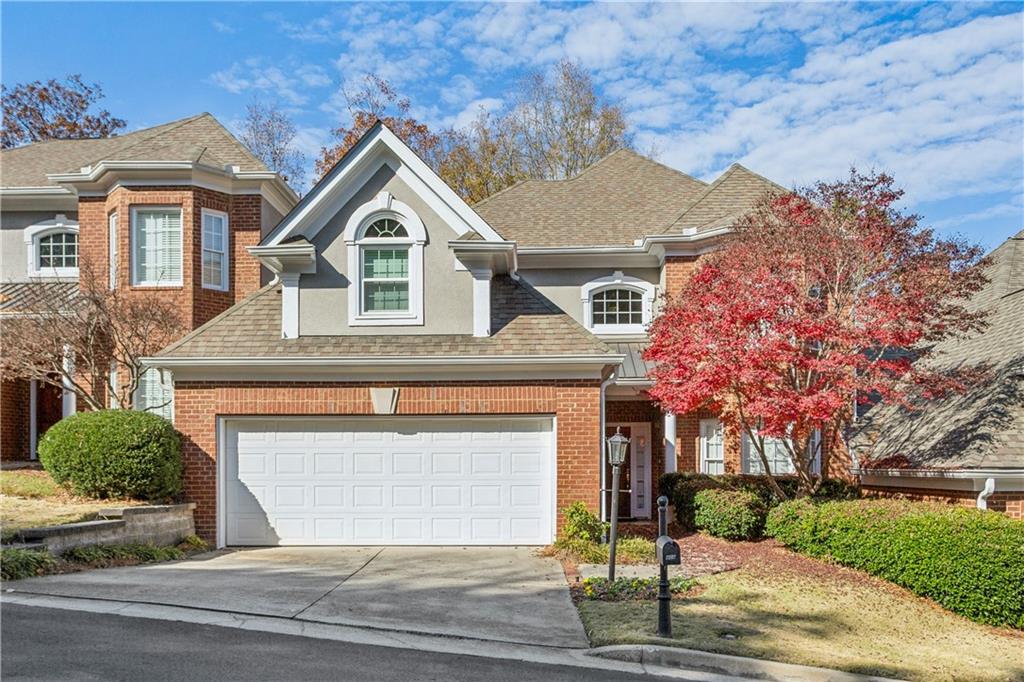 404 Brookview Circle Atlanta, GA 30339 - Photo 1 of 1 a front view of a house with yard and parking