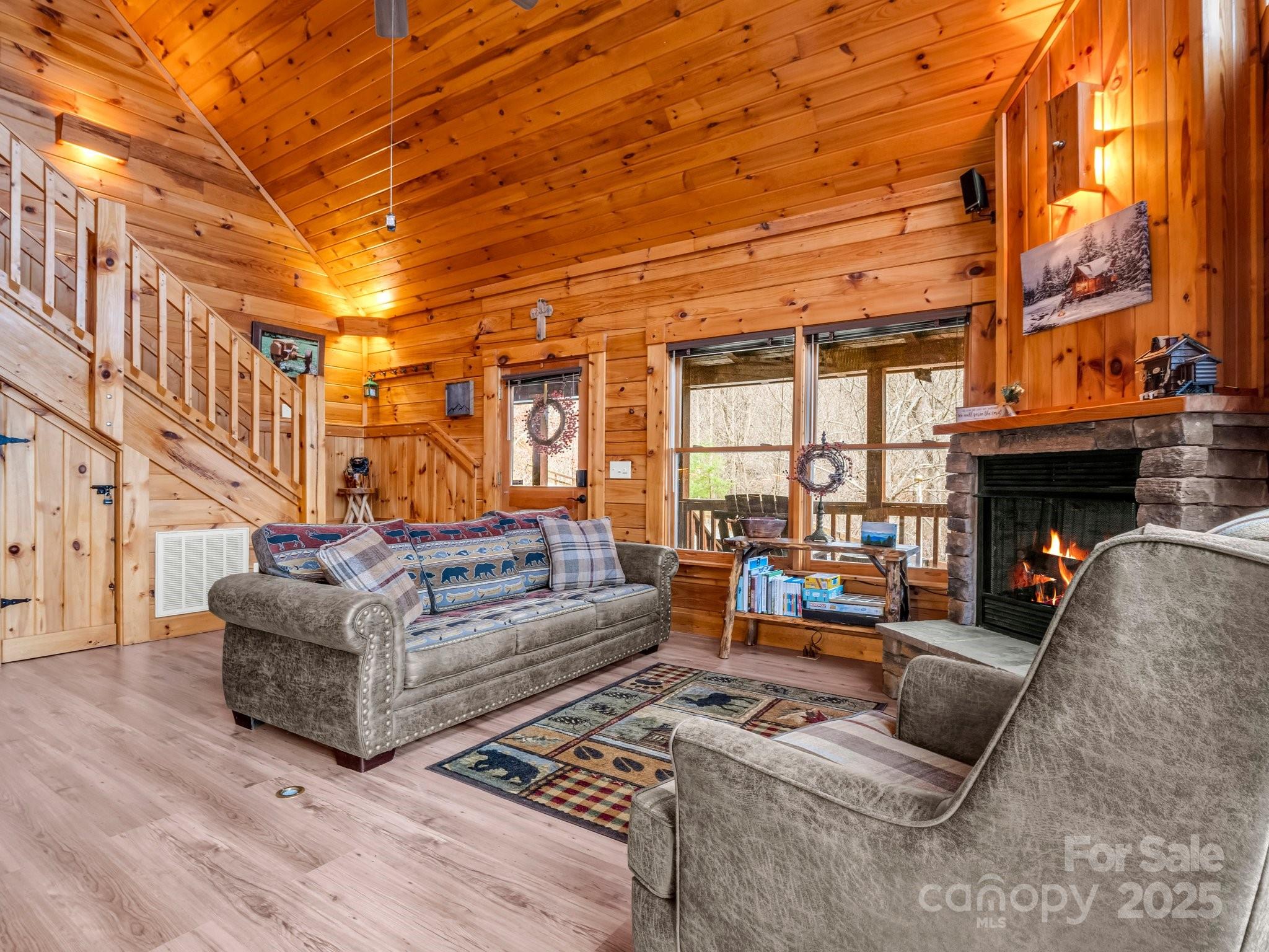 206 Dennis Ridge Bostic, NC 28018 - Photo 13 of 40 a living room with furniture a fireplace and a table
