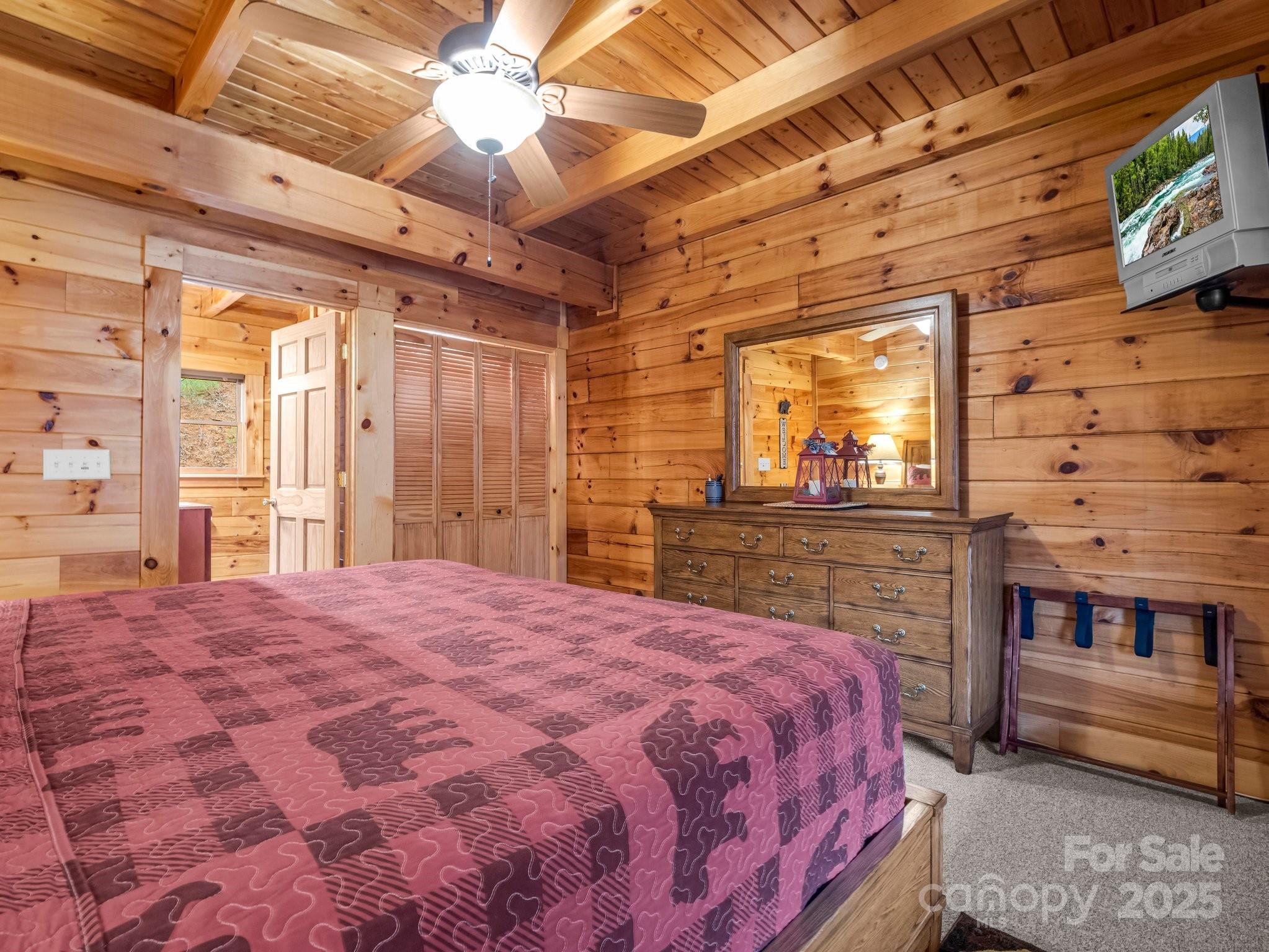 206 Dennis Ridge Bostic, NC 28018 - Photo 21 of 40 a spacious bedroom with a bed and a dresser