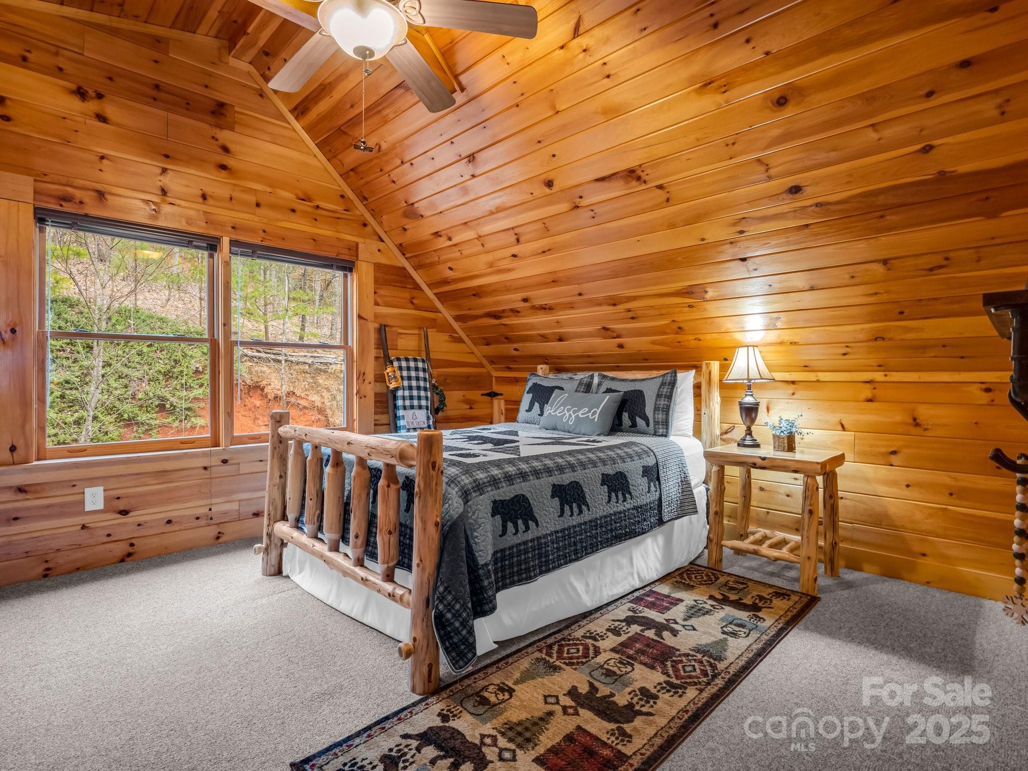 206 Dennis Ridge Bostic, NC 28018 - Photo 25 of 40 a view of a bedroom with a bed and wooden floor
