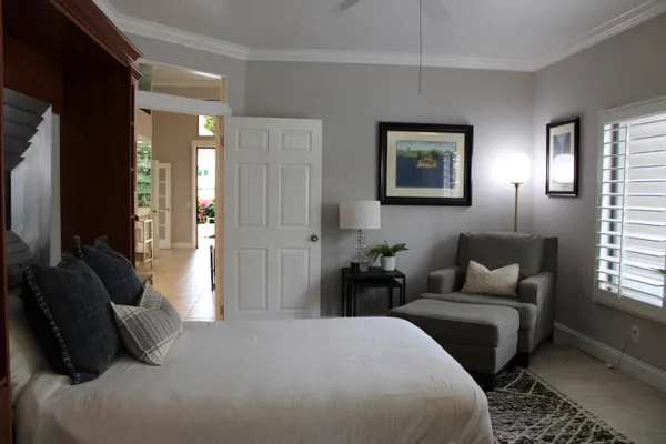 a bedroom with a bed and a couch