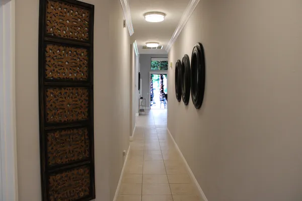 a hallway with wooden floor in a room