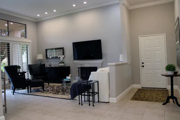 a living room with furniture and a flat screen tv
