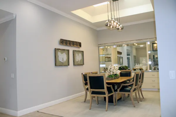 a dining room with furniture and chandelier