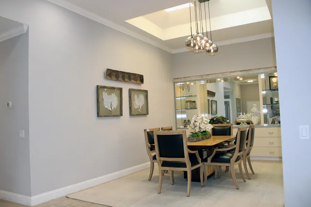 a dining room with furniture and chandelier
