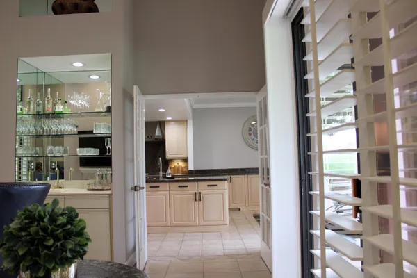 a bathroom with a sink a mirror and shower