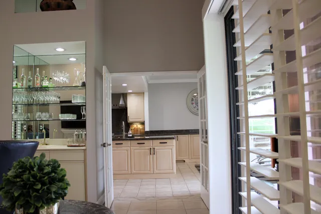 a bathroom with a sink a mirror and shower