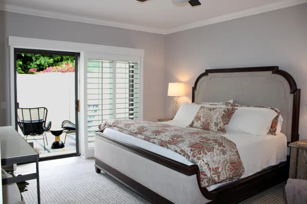 a bedroom with a bed and window