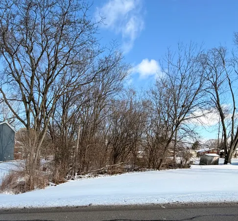 a view of a yard covered in snow