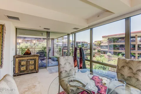 a view of a hallway with wooden floor and entryway