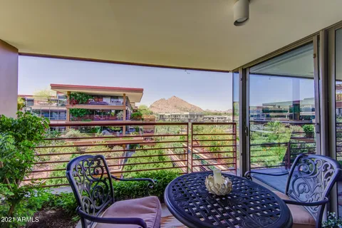 a bedroom with a large bed and a couch