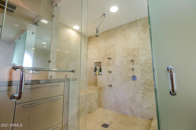 a living room with furniture a rug and a chandelier