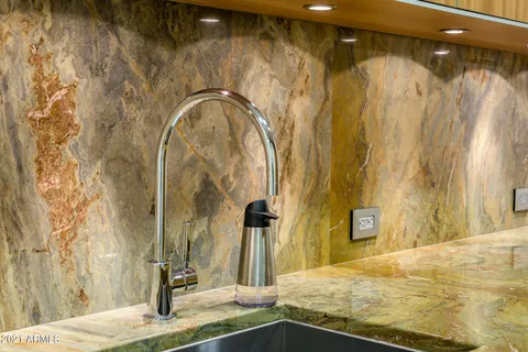 a bathroom with a double vanity sink toilet and a mirror