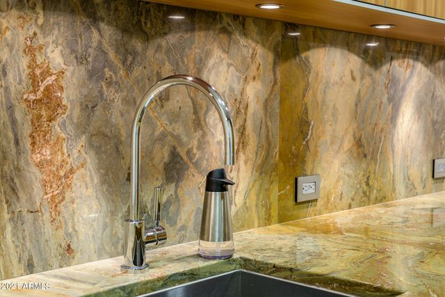 a bathroom with a double vanity sink toilet and a mirror