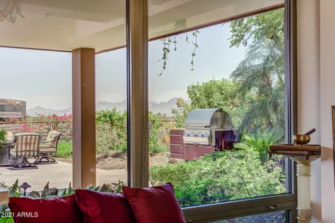 a swimming pool with outdoor seating and yard