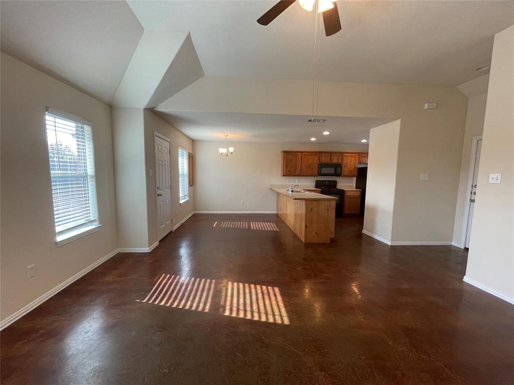 100 Crossbow Court, Unit 102 Weatherford, TX 76088 - Photo 3 of 21 a view of kitchen and hall with wooden floor