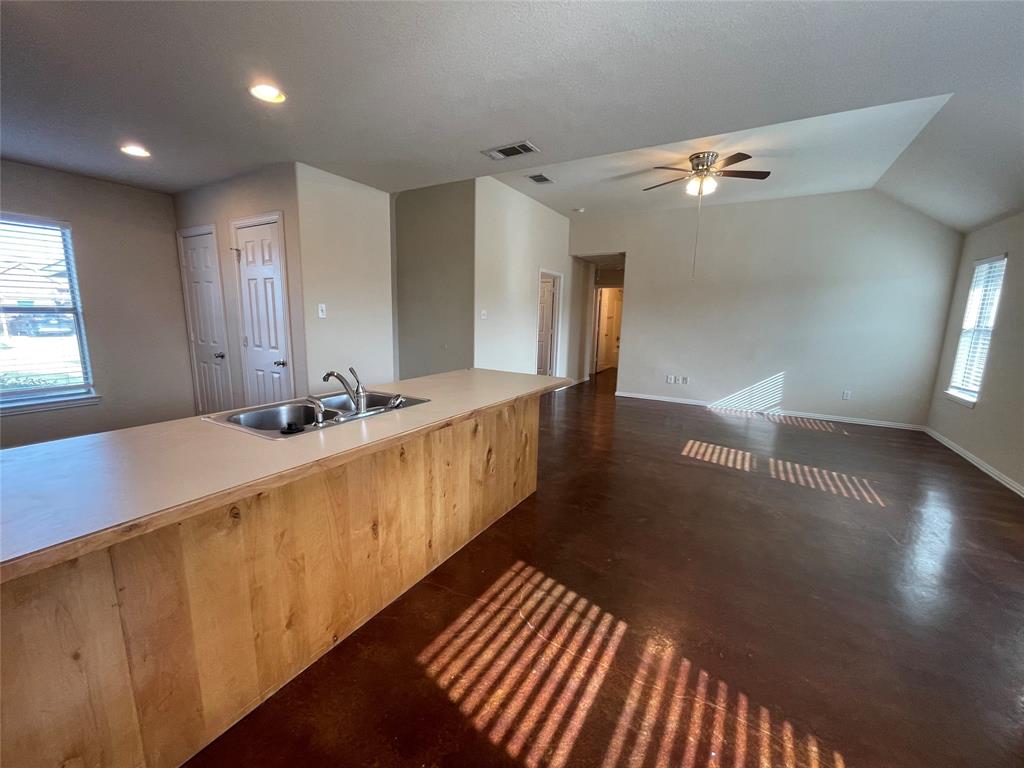 100 Crossbow Court, Unit 102 Weatherford, TX 76088 - Photo 9 of 21 a bathroom with sinks and a large mirror