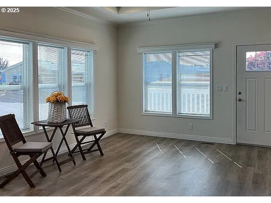 15889 Sunset Strip, Unit 7 Brookings, OR 97415 - Photo 4 of 10 a workspace with wooden floor and a window