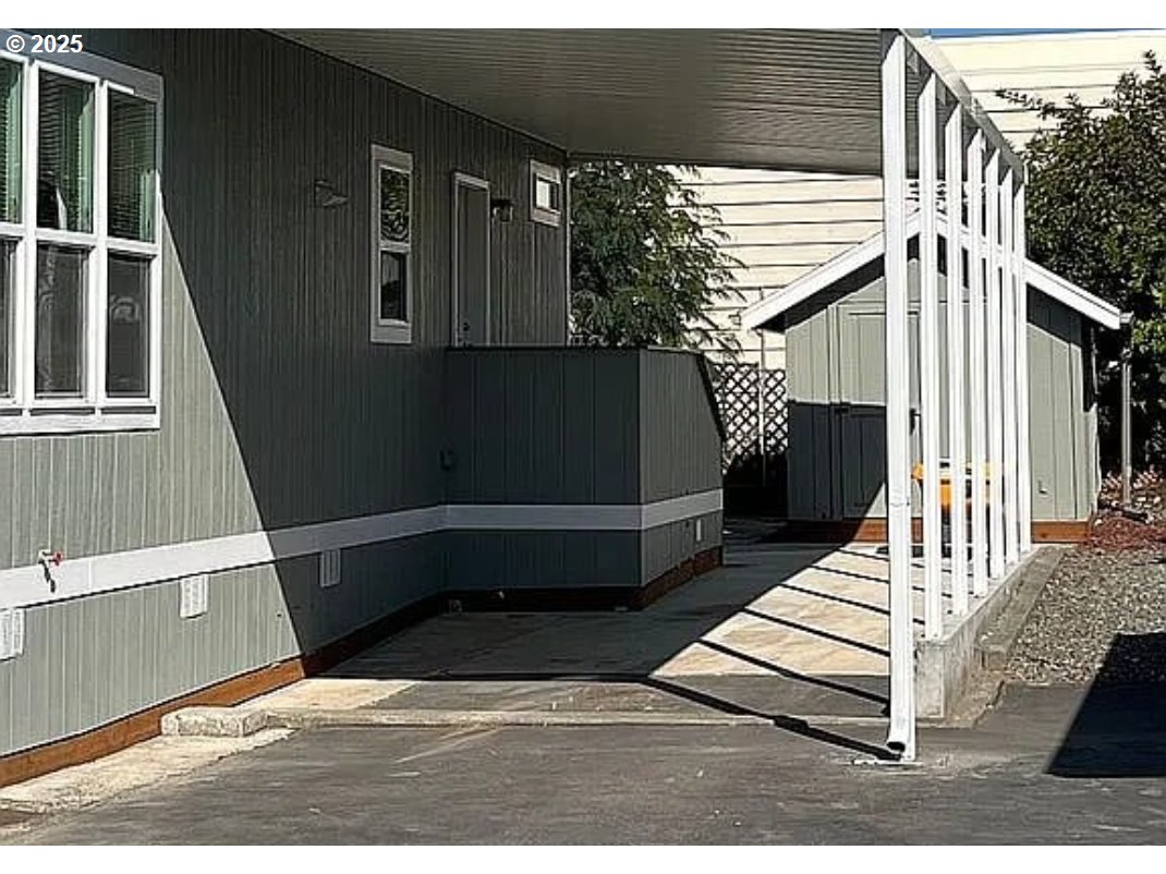 15889 Sunset Strip, Unit 7 Brookings, OR 97415 - Photo 9 of 10 a view of deck with wooden floor and chair