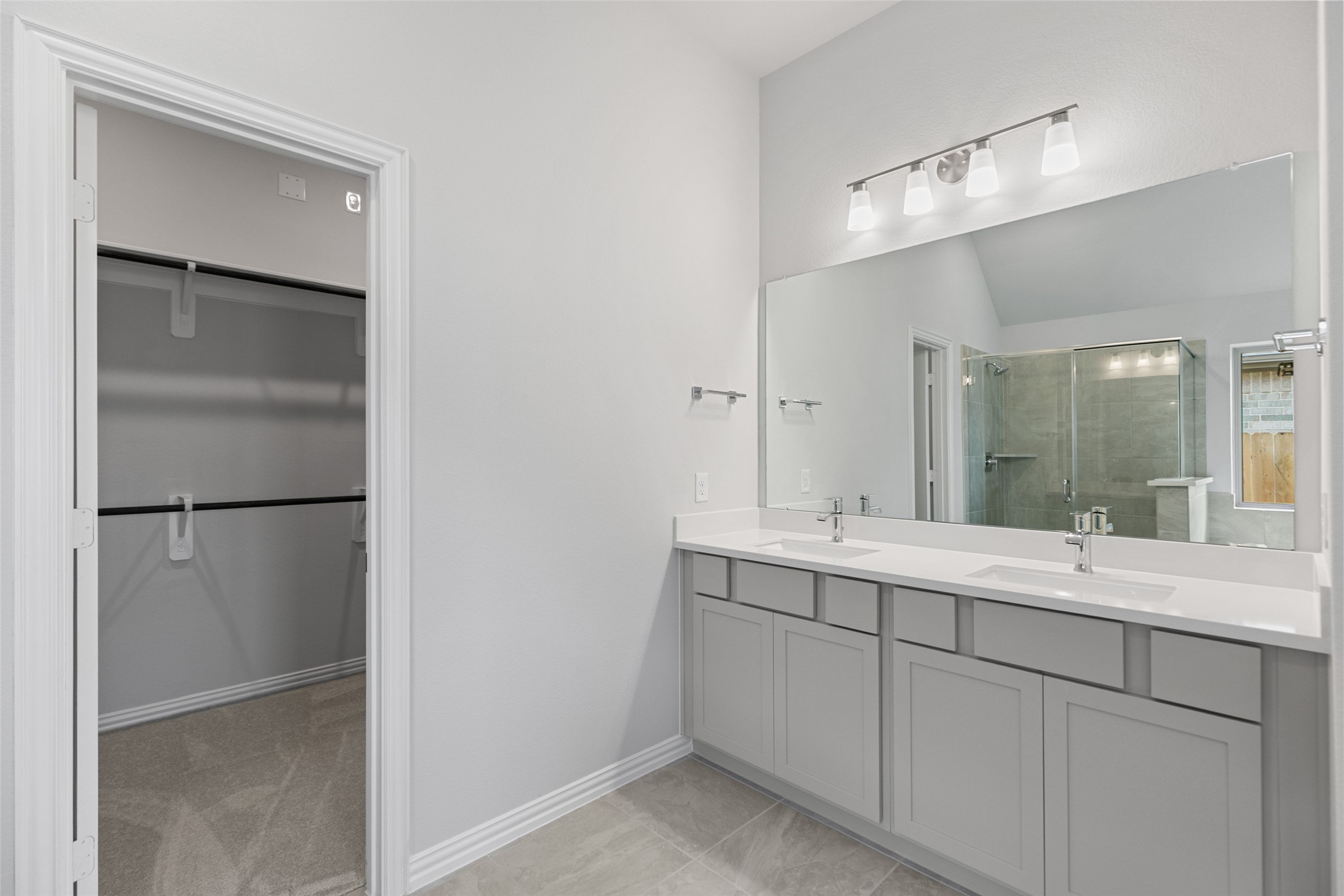 803 Evergreen Frst Lane Rosharon, TX 77583 - Photo 25 of 31 a bathroom with a double vanity sink and mirror