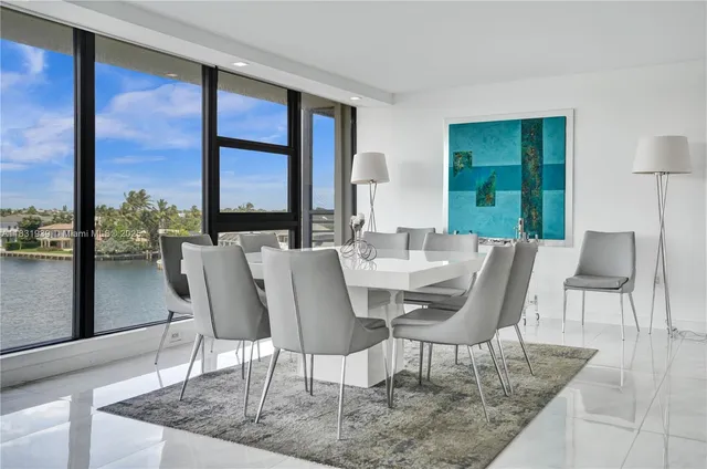 a kitchen with stainless steel appliances kitchen island granite countertop a refrigerator and a stove top oven