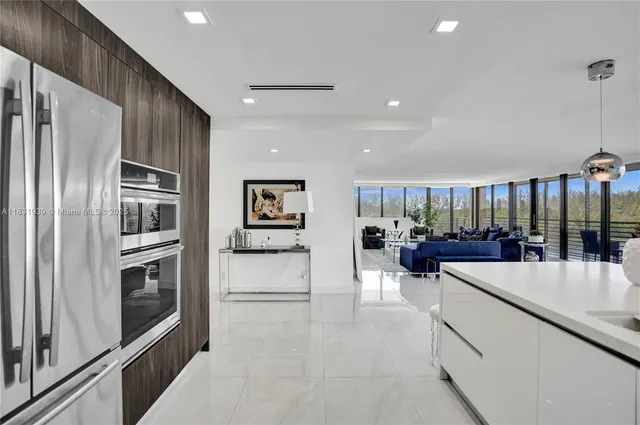 a living room with lots of furniture and clutter