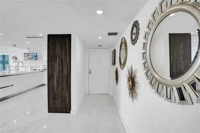 a living room with furniture a rug and a painting on the wall