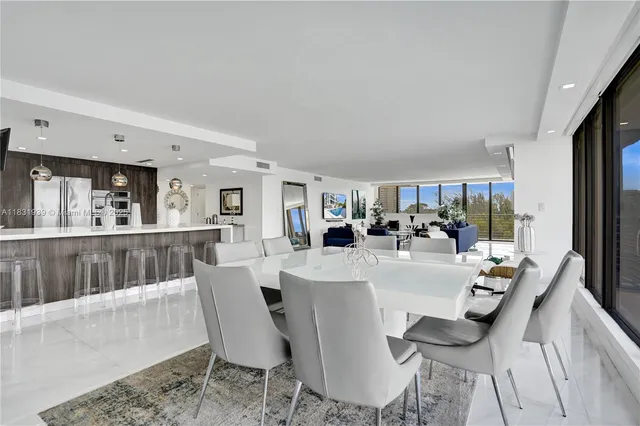 a bedroom with two beds and a large window