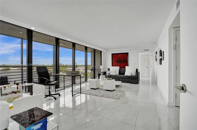 a spacious bathroom with a granite countertop sink and a mirror