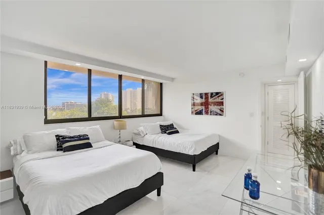 a bathroom with a granite countertop sink mirror and bathtub