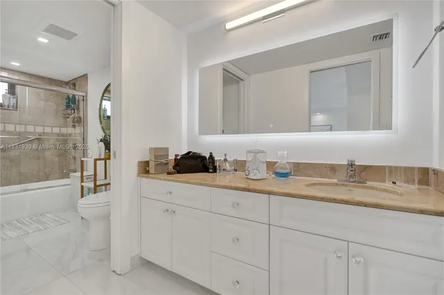 $10,000 | 900 Northeast Spanish River Boulevard, Unit 5C & 5E, Boca Raton, FL 33431